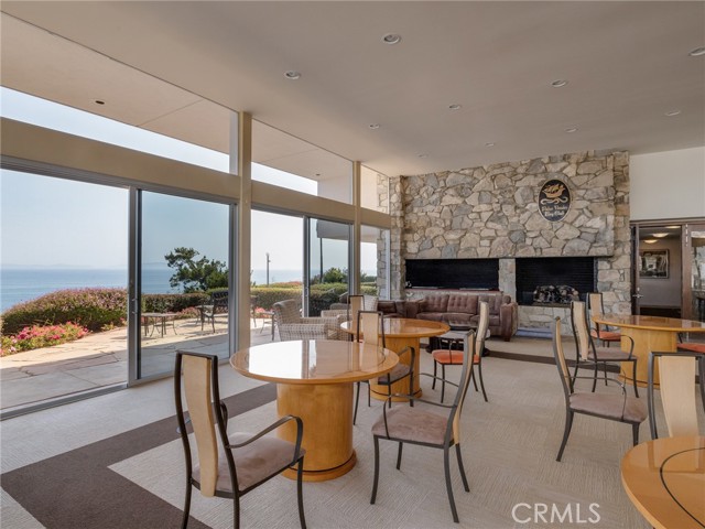 Clubhouse with fireplace and endless ocean views.
