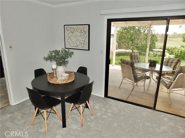 Dining room table and sliding glass door to the backyard