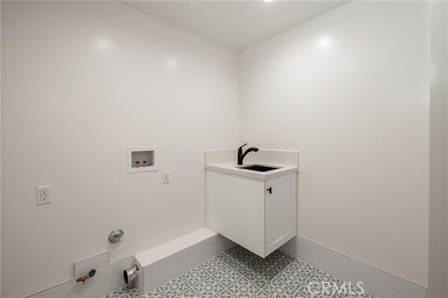 Laundry room with utility sink