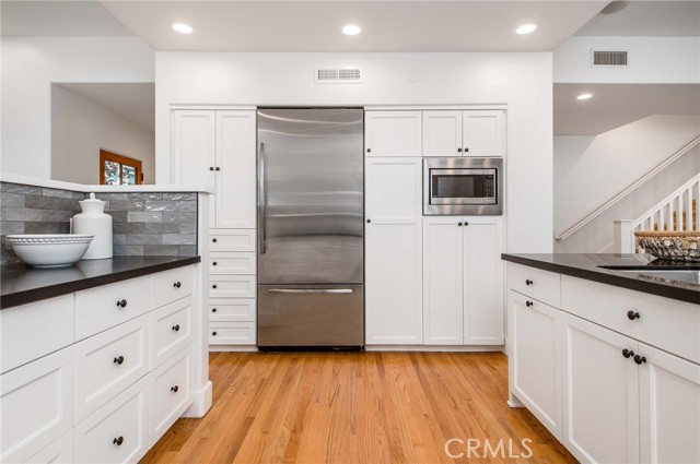 Countertop space and cabinet storage for days.