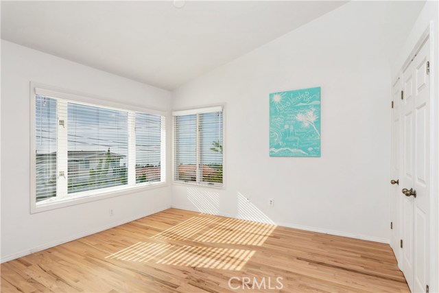 Sunny breakfast room with ocean and Catalina Island views and a wall of closets.