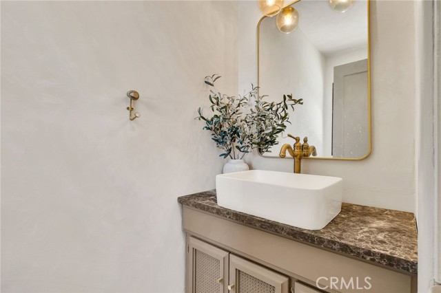 half bath on other side of kitchen with laundry room