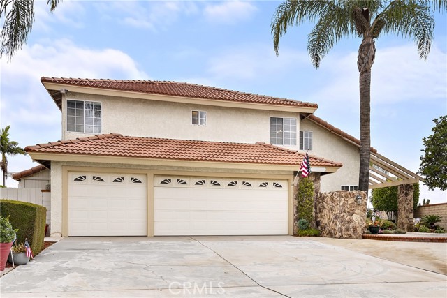 Large driveway and three car garage.