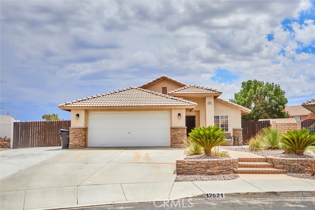 12621 Thistle Street Victorville, California Unique and rare opportunity! Must see this turnkey move in ready single-story home with beautiful hardscape for the front yard, giving the home a delight curve appeal. Futures include:
open floor concept, 4 bedroom, 2 bath plus an enclosed patio being use as an office , RV access or toys, 2 car garage and a huge lot to add a pool, covered patio for your BBQs. A gazebo that creates a relaxing getaway in your own yard, this home is Great for entertainment! Situated in a prime location.
Easy acces to the 15 freeway, minutes away from schools and shopping center. BUT THATS NOT ALL!! There’s more .. no HOA and low Tax rate!
