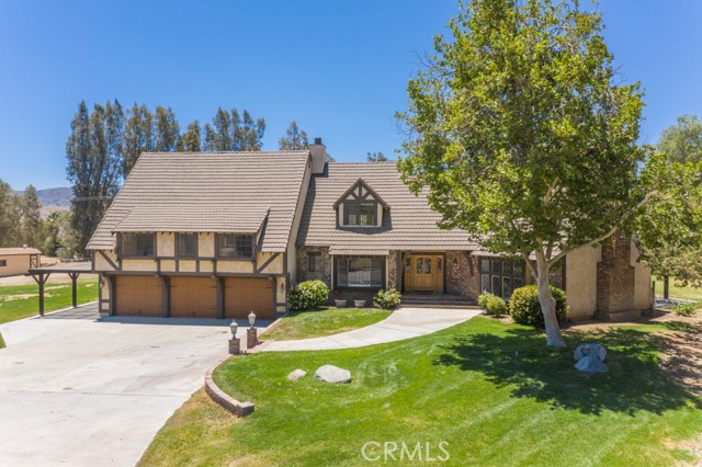 32630 Agua Dulce Canyon Road Agua Dulce, California Amazing English Tudor Estate located in the highly desired Asher Ranch area of Agua Dulce. This Spectacular home is located on nearly 5 Acres of fully fenced Horse Property including a Detached car enthusiast Garage with ADU (Guest House). The Main house features five bedrooms with five walk-in closets, 5 Baths, Formal Dining Room, Wet Bar, Living Room, Family Room, 3 Fireplaces and Large Laundry Room. The Kitchen offers Granite Countertops, Stainless Appliances and offers serene park like views. The Master Suite includes a Retreat with Fireplace and His and Hers Walk In Closets. All of the expansive living areas work well together providing open space with lots of natural light. There is also an attached 3 Car Garage.
For the car collector/toy enthusiast the detached Garage is approx 40 x 40 with three roll-up doors – including straight pull-through RV storage and epoxy floors. 2 of the Roll up Doors are approx 12' Tall. The storage above the Garage could easily be converted into an Office or Loft.
The ADU Unit is fully self contained with a Full Kitchen, Large Living Space, Separate Bedroom and Full Bath. It is accessed from a Private Entrance off of the Detached Garage.
This unique property provides peaceful, private and gracious country living only minutes from the freeway with convenient access to every modern amenity desired. The homes exterior was laid out to entertain on a grand scale while still affording intimate spaces to enjoy a unique property not to be missed. The Property includes 2 Wells, a Firepit, Inground Trampoline, Tree House, Shed, Built In BBQ and large Covered Patio.
You must see this beautiful property to appreciate, call today for a Private Viewing.