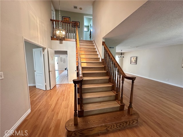 New LVP floor & oak handrail staircase