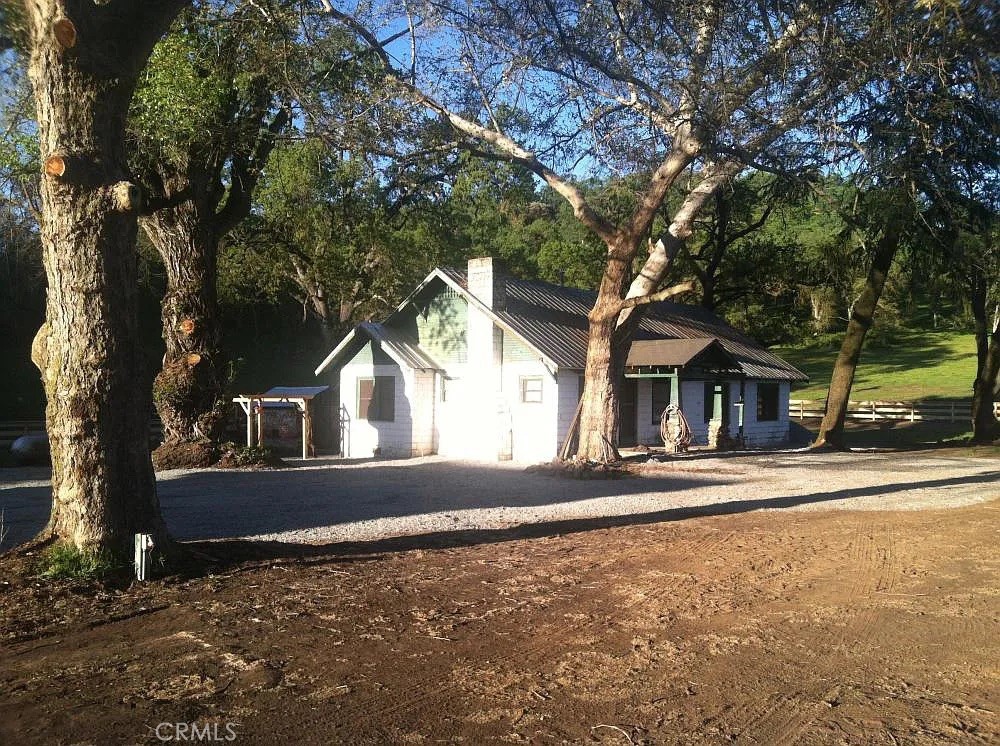 Mixed-use ranch including 3 bd/1ba cinder block cabin, barn, lake and more. Land consists of 5 parcels totaling 903+ acres. There is a well near the lake that produces approximately 55 gal/min at 60’ depth as well as several natural springs. Property also includes 3.76 acre lot which includes a mine and abandoned rail line. The 3.76 acre mine is not attached to the ranch but was purchased with the other acres. It sets on a hilltop along other mines that are no longer in service. It also has an area for a landing strip which has since been grassed over but has no FAA registration for a landing strip . Property currently has month to month lease limited to a 180-acre subdivision. Leasee oversees all activities on the ranch and maintains all the fencing. Located close to I-180 and 60 hwy. The ranch has for decades been an ecological preserve and there are many species throughout the ranch. The local species are quail, tree squirrels, ducks, wild turkeys, rabbits, deer, coyotes and occasionally a bear and mountain lions. The terrain is varied and allows for a spacious habitat for many of these species to make their home there. Migratory geese, doves, wild birds, hawks, eagles transit at various times of the year. The vegetation is mostly grass land for cattle and horses with oak trees throughout. Part of the ranch is registered under the Williamson Act as a environmental preserve and the taxes are very low.