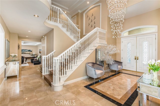 Marble floors and sweeping staircases accent your entryway. Marble floors and sweeping staircases accent your entryway.