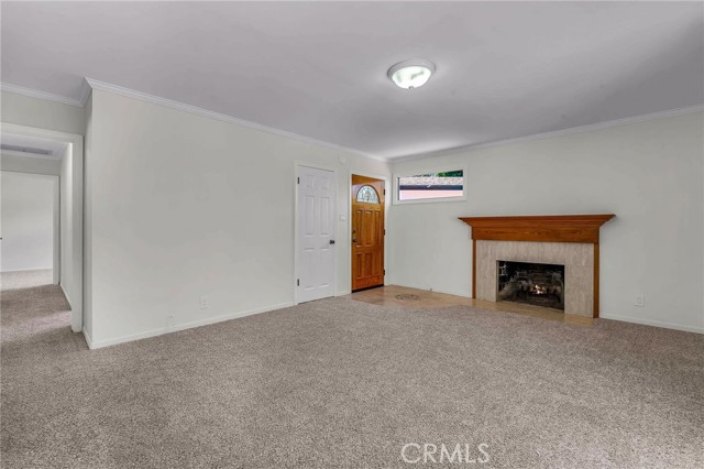 Living room looking toward front door and firplace