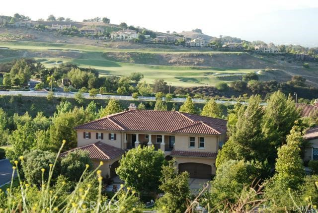 Welcome to this exquisite Vellano Model Home, nestled in the gated community of Vellano. Meticulously upgraded and professionally decorated—including over 30 curated oil and classical paintings—this stunning residence offers a versatile floor plan that can accommodate up to 6 bedrooms, currently configured as 4 spacious suites, each with its own private bathroom (including a convenient downstairs bedroom suite).  

Step outside to two private balconies, where you’ll enjoy breathtaking front and rear views, along with spectacular sunsets and sunrises. The home also boasts an impressive 4-car garage (two separate 2-car garages) for ample parking and storage.  

The gourmet kitchen is a chef’s dream, featuring stylish granite slab countertops, professional-series appliances, a built-in Sub-Zero refrigerator, and a whole-home water filtration system. A built-in stereo sound system spans the first floor, living room, and primary suite, creating an immersive ambiance for entertainment and relaxation.  

The luxurious primary suite includes two retreat areas with a fireplace, a separate jetted tub, two walk-in closets, and private balcony access. Additional highlights include full high-end appliances, including a TV, washer, and dryer for effortless modern living.  

The professionally landscaped front and rear yards create a serene retreat, complete with a decorative cobblestone deck and a custom outdoor fireplace. From every window, take in sweeping views of rolling hills, sparkling city lights, and lush gardens.

Don’t miss the chance to own this truly special property and schedule a private tour today.