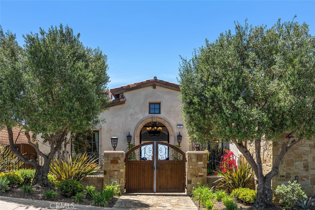 Escape to your own true resort-caliber estate in this elegantly timeless villa, exquisitely crafted in the Mediterranean style and offered **fully furnished** in California's most exclusive guard-gated oceanfront community, The Strand at Headlands. Breathtaking ocean views abound throughout this private retreat, which is graced with bespoke amenities such as an ocean-view salt water infinity pool and spa, stone loggia, sprawling entertaining terrace with outdoor fireplace, fitness/massage room with dry sauna and steam, huge game room with custom billiards table and an 18' full bar, walk-in wine cellar/tasting room, home theater room, outdoor cooking area, and privately gated front courtyard. The property underwent a complete restoration in 2024. The sweeping great room opens the kitchen to formal dining and sitting areas, and features stone floors, colonnades, and barrel-vaulted and beamed ceilings. The kitchen is well-appointed, with multiple sinks, dishwashers and refrigerators, double oven, an oversized stone island bar, a butler's pantry, secondary dining area and ample storage cabinets. The primary suite features 2 view balconies, separate lounge/office, lavish double bathroom, 2 walk-in closets, tray ceiling, and fireplace. All of this is orchestrated on a grand scale encompassing 5 bedrooms and 8.5 baths – over 9,000 square feet – with 4 garage spaces, 5 fireplaces, 4 balconies, multiple water features, and gardens spanning an oversized lot. Very high ceilings and slide-away glass doors invite natural light throughout the day. Discerning visitors will appreciate the meticulous craftsmanship of this fine home, with custom furniture curated for every indoor and outdoor space. 

The renowned Strand at Headlands community, one of the most affluent gated neighborhoods in the world, offers an oceanfront clubhouse and pool, private beach lockers, walking and biking trails, and golf-cart parking behind private gates. It is in very close proximity to Dana Point's recently renovated Lantern District, and also Dana Point Harbor, currently being revitalized to be one of the most vibrant marine districts on the west coast.