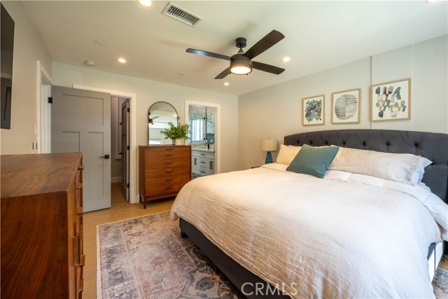 Main bedroom with view of bathroom and walk in closet