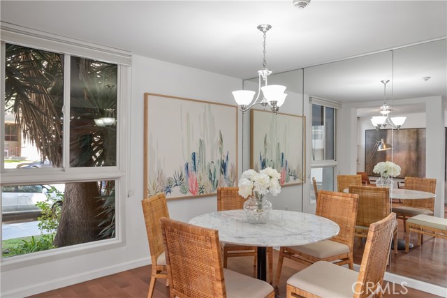 More large windows in the dining room face trees for privacy & views