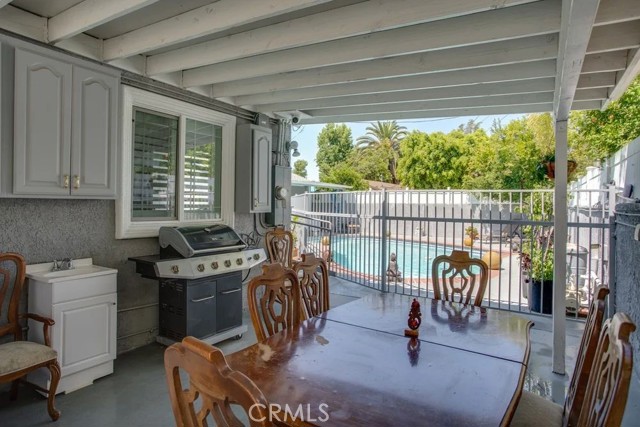 Outdoor seating and laundry area.