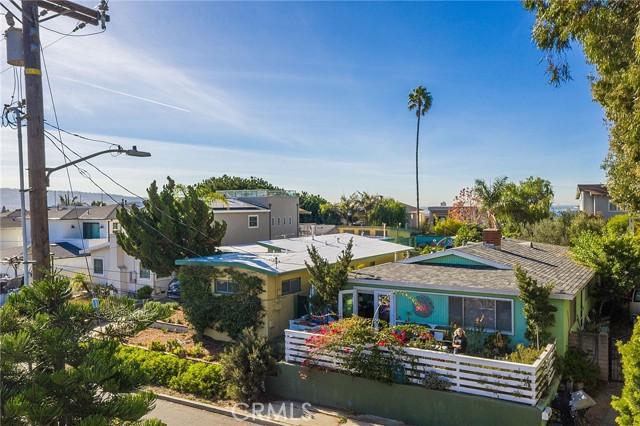 Drone photo of ocean view from approximately 25 feet above the sidewalk in front of the home.