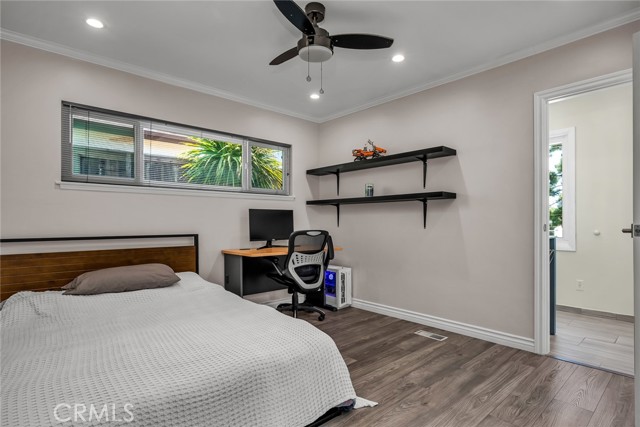 Rear bedroom has private bath leading to pool.