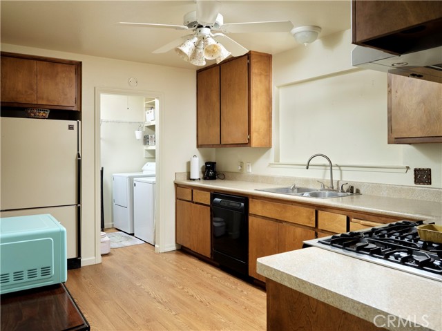 Separate laundry room with pantry and additional storage