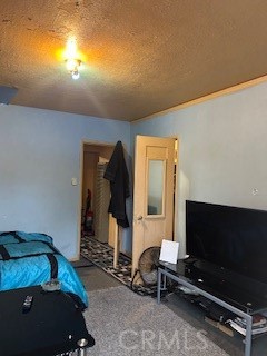 view of closet door and hallway to bath and kitchen