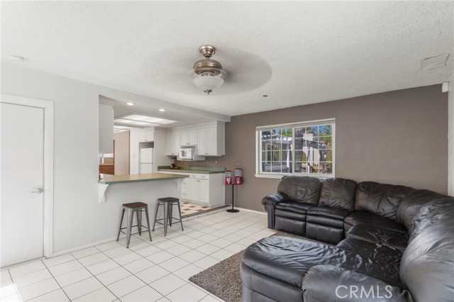 Large living room space open to kitchen. Direct access to laundry room.