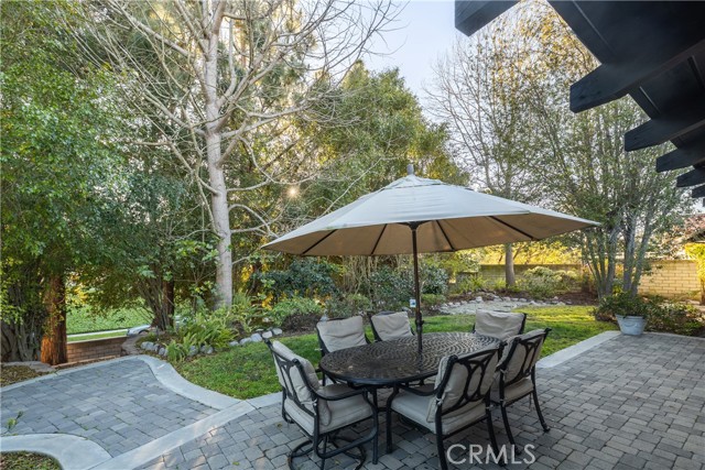 The backyard is a tranquil outdoor space perfect for entertaining, play, and relaxation.