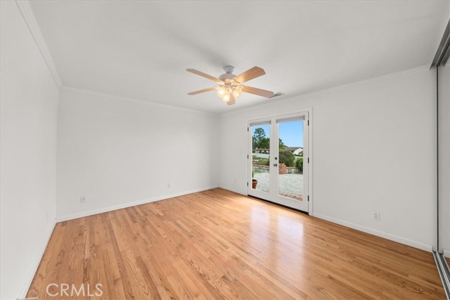 Bedroom #4 with French Doors leading out to backyard patio.