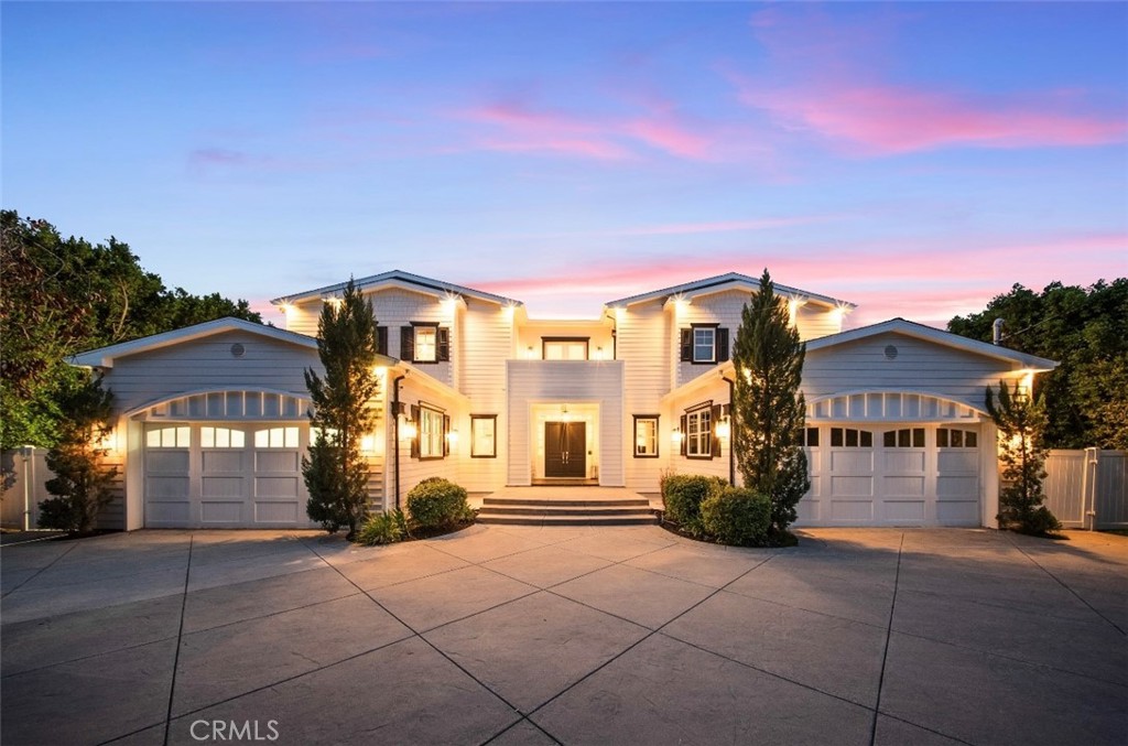 Nestled within the prestigious Amestoy Estates, luxury mansion With Detached 1 Bedroom Guesthouse sits on a HUGE ¾ ACRE(one of the largest lots in Amestoy) exclusive flag lot along a private Street, gated Compound, offering privacy, security, and sophistication This Tri Level estate welcomes you with an impressive Oversize motor court, parking for 20+ vehicles, a covered carport, 4-car garage, and a circular driveway framed by towering gates for maximum privacy. This home offers 24-hour live surveillance, (Edgeworth Security Company) featuring over 30 interior and exterior cameras, including Avigilon commercial-grade cameras with facial recognition(airport-quality) motion and window sensors. Security is further reinforced with ADT 24 Hour guard patrolling. Crestron Smart Home automation, this residence is equipped with premium interior and exterior sound speakers, automatic drapes lights, shades, and a fully integrated security system. Soaring cathedral ceilings and double staircases enhance the grandeur, while expansive windows flood the home with natural light this tri-level estate is an entertainer’s dream, featuring a massive home theater with a floor-to-ceiling 180-inch media screen, elevated seating, and premium projection & sound equipment. Additional entertainment a Lower-level game room, Indoor gym, Indoor lap pool Indoor sauna, Temperature-controlled wine cellar & wine fridge Gourmet Chefs Kitchen is outfitted with an Oversize center island, 60-inch Viking range with Double Oven, Full Viking fridge & freezer Wolf Built-In espresso machine, Warming tray Butler pantry, Walk- in Pantry Custom built-ins & an abundance of cabinetry throughout the Gigantic primary suite is a private retreat, featuring: Grand double-door entry, Gas marble fireplace, Blackout drapes, Dual privacy toilets, Oversized jetted marble soaking tub, Steam shower with dual shower heads Two vanities & dedicated makeup station oversized custom walk-in closets with a center island and Custom Built-Ins, (additional Walk-in Closet) Private oversized balcony with fireplace All Bedrooms are Huge all En-suite with Walk in Closets The resort-style backyard boasting: Oversized swimming pool with a built-in spa & Baja area Custom-covered cabana with seating for 20, bar area & 2 grille stations Full-size sports court, A Commercial Grade Full House Generator (Generac) DETACHED 1 BEDROOM GUEST HOUSE with Kitchen(Currently being used as a Professional Recording Studio) Park-like grounds
