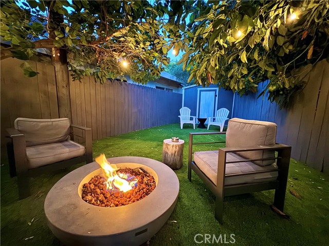 Backyard with fireplace and turf