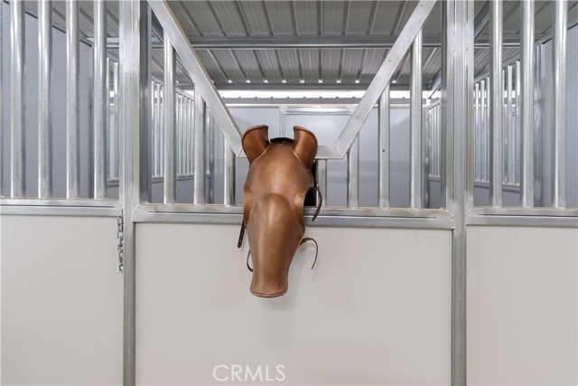 Imagine your treasured horse settling into this brand-new barn designed for refined equestrian living.
