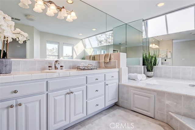 Master suite bath with 2 separate private comodes