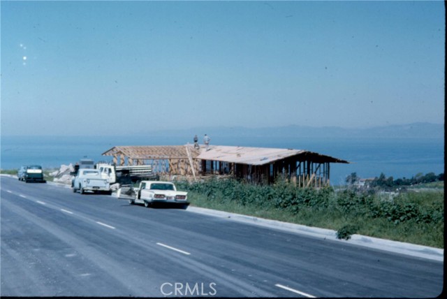 BLAST FROM THE PAST! How do you get the best view in town? You walk up the hill before the streets were installed and pick the best view lot to build your dream home on. Then you build a house where you get ocean views from every room!