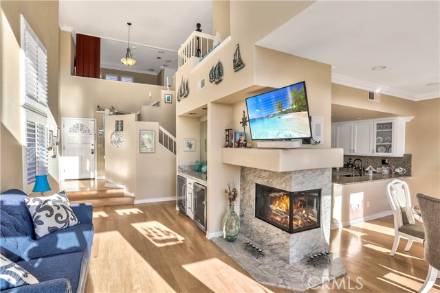 The living room also has dual wine fridges, a gas fireplace and plenty of natural light.