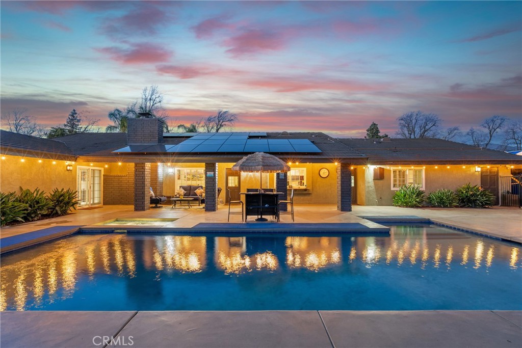 **Exceptional Single-Story Estate with Pool, RV Parking & Entertainment-Ready Design**  

This **stunning single-story home** is the epitome of **luxury, comfort, and convenience**, offering an unparalleled lifestyle in a prime location. Thoughtfully designed with **entertainment in mind**, this home boasts a **sprawling floor plan** that seamlessly blends elegance with functionality.  

Inside, the **living room’s picture windows** fill the space with natural light, while the **formal dining room** sets the stage for memorable gatherings. The **chef’s dream kitchen** features **coffered ceilings, commercial-grade appliances, an oversized island with a sink, and countertop seating**—all opening into the inviting family room for effortless hosting.  

The **west wing** of the home is a true retreat, featuring a **luxurious primary suite** complete with an **en-suite spa bathroom**, offering **dual vanities, a makeup counter, a sunken tub, a separate shower, and a spacious walk-in closet**. Three additional oversized bedrooms share a well-appointed hall bath with an adjacent laundry room.  

The **east wing** provides exceptional versatility with a **private bedroom, walk-in closet, full bath, and a dedicated theatre room**—perfect for guest quarters or a **junior ADU conversion**.  

Step outside to an **entertainer’s paradise**, featuring **professional landscaping, a sparkling in-ground pool and spa, a detached 12' x 23' pool house/casita, an under-roof covered patio, and a pergola**—ideal for outdoor dining and relaxation. The **gated RV parking** includes **50 Amp electrical and water service**, adding convenience for adventurers.  

Additional features include **LED lighting, a built-in entertainment system, a private dog run, a Tuff shed, a Hass avocado tree and a Meyer lemon tree, and an electric solar system (leased; buyer to assume).**  

**Unbeatable Location**  
Nestled in a **prime area near award-winning schools**, this home is **steps from the scenic Euclid Bridle Path**, perfect for morning jogs or evening strolls. Enjoy the nearby **shopping and dining at Colonies Crossroads, easy access to Ontario International Airport, and major freeways (10 & 210),** ensuring seamless connectivity.  

Don’t miss this rare opportunity to own a **dream home that truly checks every box**—schedule your private tour today!