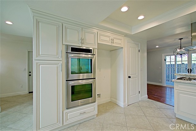 Double oven with microwave above in the cabinet