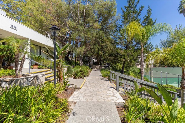 The Estates clubhouse entrance from the tennis courts.