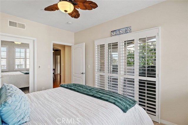 Wood shutters accent doors to the balcony.