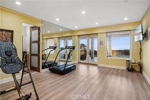 Gym room with patio, bathroom, and Aqua Massage Spa