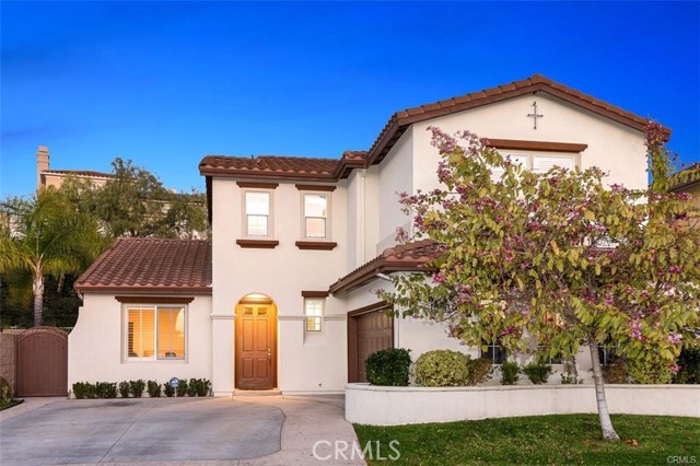 23056 Mountain Mission Viejo, California Prestigious 24 HOURS Guard Gated community in Stoneridge. Located in a Quiet Cul-De-Sac and LAKE AMENITIES. Nicely upgraded house feature Chef's Kitchen, Quartz counters, stainless steel appliances, stone tile and wood like laminate flooring, crown molding, plantation shutters. stone tile fire pit with water feature, built in BBQ and outdoor bench with professional landscaping. Access to Lake Mission Viejo. New paint.