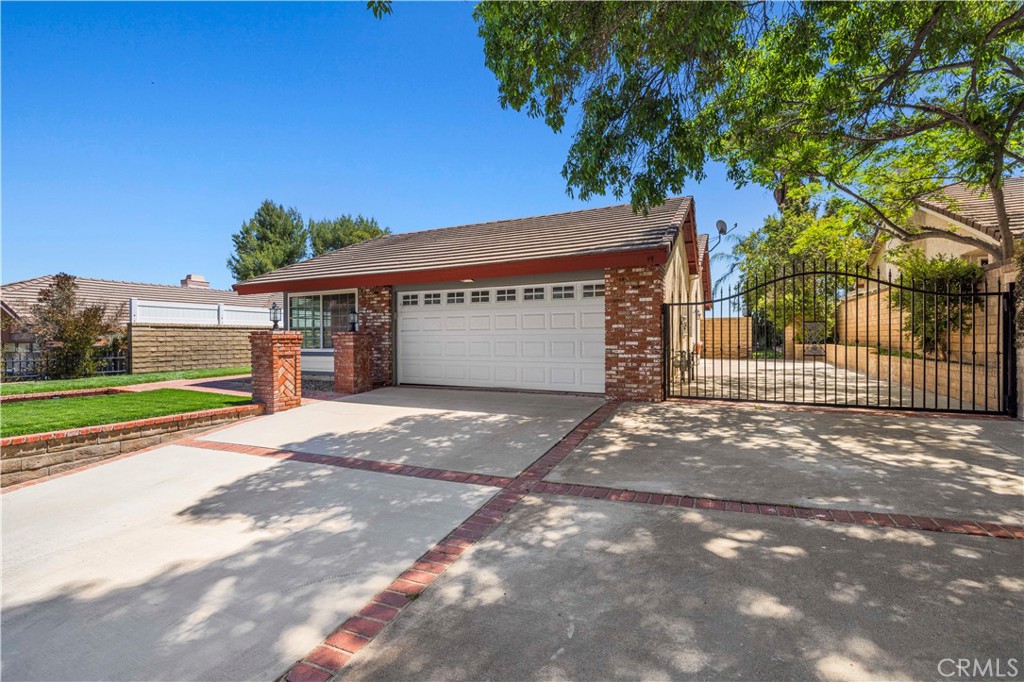 Welcome to your dream single-story home in the highly sought-after Lakeview community of Castaic—where comfort, convenience, and charm collide! This 3-bedroom, 2-bath beauty sits on a spacious lot with amazing curb appeal, featuring fresh sod, custom brickwork, a large driveway, and gated RV parking.

Step inside to a well-thought-out layout with both a cozy family room and a separate living room anchored by a warm fireplace—perfect for relaxing or entertaining. The wide open kitchen is the heart of the home, complete with stainless steel appliances and a clear view of the sparkling pool, private backyard, and scenic mountain and valley vistas.

The master suite includes a walk-in closet, and both bathrooms have been stylishly remodeled. Ceiling fans in every bedroom add comfort year-round, and the solar panels help keep energy costs down.

Located just 2 minutes from the 5 freeway, this home offers unbeatable convenience with no HOA fees and no Mello Roos!

This one is priced to sell—schedule your private tour today before it’s gone!