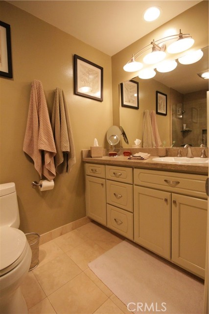 Remodeled Master Bath with limestone counters and travertine flooring!