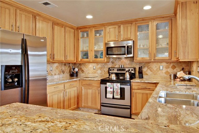 Recessed lighting and interior cabinet lights for the glass front cabinets