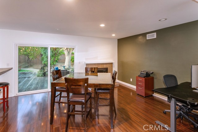 The dining/family room fittingly adjoins the kitchen and with its recessed lights, raised hearth fireplace with tiled surround and sliding glass doors to the backyard, it is perfect for any occasion.