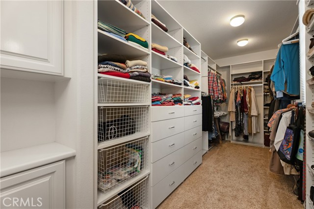 Primary bedroom with custom closets.