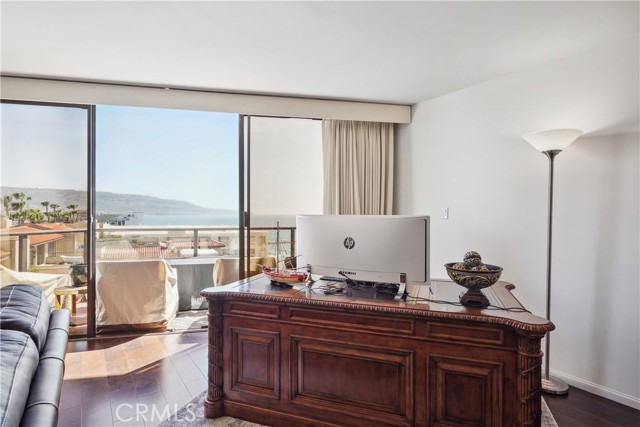 A Wall of Sliding Windows opens to the Panoramic Ocean Whitewater View Balcony/Deck. The Windows Flood the Living Room with Light and Ocean Breezes