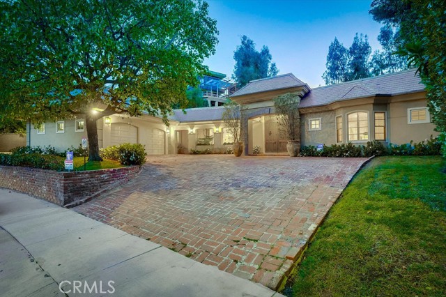 1143 Maybrook Beverly Hills, California Discover your new life in this gorgeous one story home in a desirable area of Beverly Hills. This exquisite private residence is a masterful blend of art deco and Mediterranean architectural styles. Enter through an elegant french door into a wide-open grand foyer with a height ceiling. Spacious living room comes with a fireplace and a wet bar. Bright and airy family room overlooks a spectacular backyard that features a sparkling pool, spa, waterfall and fire pit that are great for entertaining. Gourmet kitchen features stainless appliances, including two built-in ovens, a built-in refrigerator, granite countertop, an island, a breakfast nook and a separate wok kitchen. Master bath with an oversized Jacuzzi water jet tub, step-in shower and dual vanities. Plenty of storage space in the master walk-in closet with custom shelving. 4 suites with their own private bathroom. The 5th bedroom can be used as a home theater. Prime location close to Harvard-Westlake School, shopping, dining and entertainment. This beautiful home awaits your arrival for the new life you have been looking for.