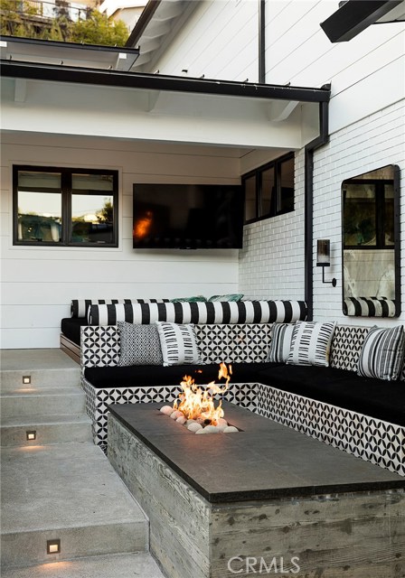 Fire pit and couches to sip and go for a dip