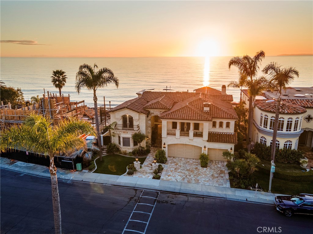 Perched on a breathtaking oceanfront bluff in the prestigious guard-gated community of Cyprus Cove, 3824 Vista Blanca is a one-of-a-kind coastal estate. Built in 2002 on 42 deep-set caissons with partial concrete construction, this architectural masterpiece offers unparalleled stability and longevity on the bluff. Spanning nearly 7,000 sq. ft. of exquisitely designed living space on a 13,068 sq. ft. homesite with 70 feet of prime ocean frontage, this residence is a true trophy on the Pacific. Luxury amenities abound, including private beach access, a state-of-the-art theater, a temperature-controlled wine cellar, and uninterrupted panoramic views stretching from Dana Point to San Diego. Offered at $12.9 million, this estate presents an extraordinary value at just over $1,800 per square foot—a remarkable opportunity compared to Newport Beach’s oceanfront properties averaging nearly $3,000 per square foot and Los Angeles County’s ultra-exclusive coastal homes exceeding $4,500 per square foot. Ideally positioned between San Diego and Los Angeles International Airports, with convenient access to John Wayne Airport and Carlsbad’s private aviation facilities, this exceptional residence offers effortless accessibility for discerning buyers seeking an iconic California retreat.**There will be no scheduled open houses for this property. Private tours for qualified buyers only. The seller is offering owner financing at a competitive 5% interest rate for qualified buyers.**