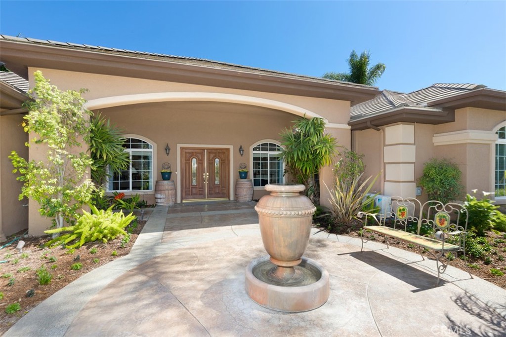 43978 El Lucero Place Temecula, California This beautiful custom built home sits at the end of a quiet cul-de-sac in the desirable neighborhood of Santiago Estates and boasts Panoramic Views! There is no shortage of upgrades to this beauty, you'll find custom lighting, upgraded ceiling fans, surround sound (outside too), vaulted ceilings, custom window coverings, wood blinds, hardwood flooring, slate, carpet, plaster walls, crown molding, custom base, and plenty of natural light. The open floor plan invites you into the Family room where the upgraded linear gas fireplace w/ waterfall edge quartz raised hearth & custom marble tile is undoubtedly the focal point of the home. The built-in 75” Samsung “smart TV” / entertainment system & theatre style surround sound will entice you to stay. The Kitchen has been newly remodeled with custom cabinetry, pullout shelves, soft closing drawers, brick facade/ backsplash, marble & quartz countertops, and an oversized counter depth commercial grade individual Samsung freezer and individual Samsung Smart refrigerator w/ interior blue tooth camera. The large island w/ Carrara marble countertop has an instant hot water dispenser, and a Villroy & Bosch black fireclay prep sink. The newly upgraded black stainless KitchenAid appliances, gas cooktop w/ pot filler, the desirable walk-in pantry, microwave, 2 standard/convection ovens, Villroy & Bosch fireclay Farm sink, and the Reverse Osmosis drinking water system make this kitchen a wonder to prepare any meal. NO MELLO ROOS or HOA!