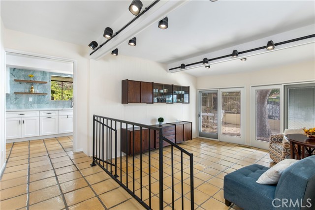 Sunken formal dining area with access to courtyard, rosewood built in buffet