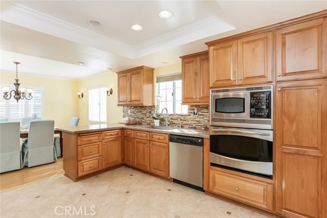 Oven, microwave, dishwasher, porcelain counter, glass back splash