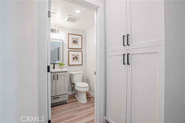 Main level half-bath and linen closet and/or kitchen pantry.
